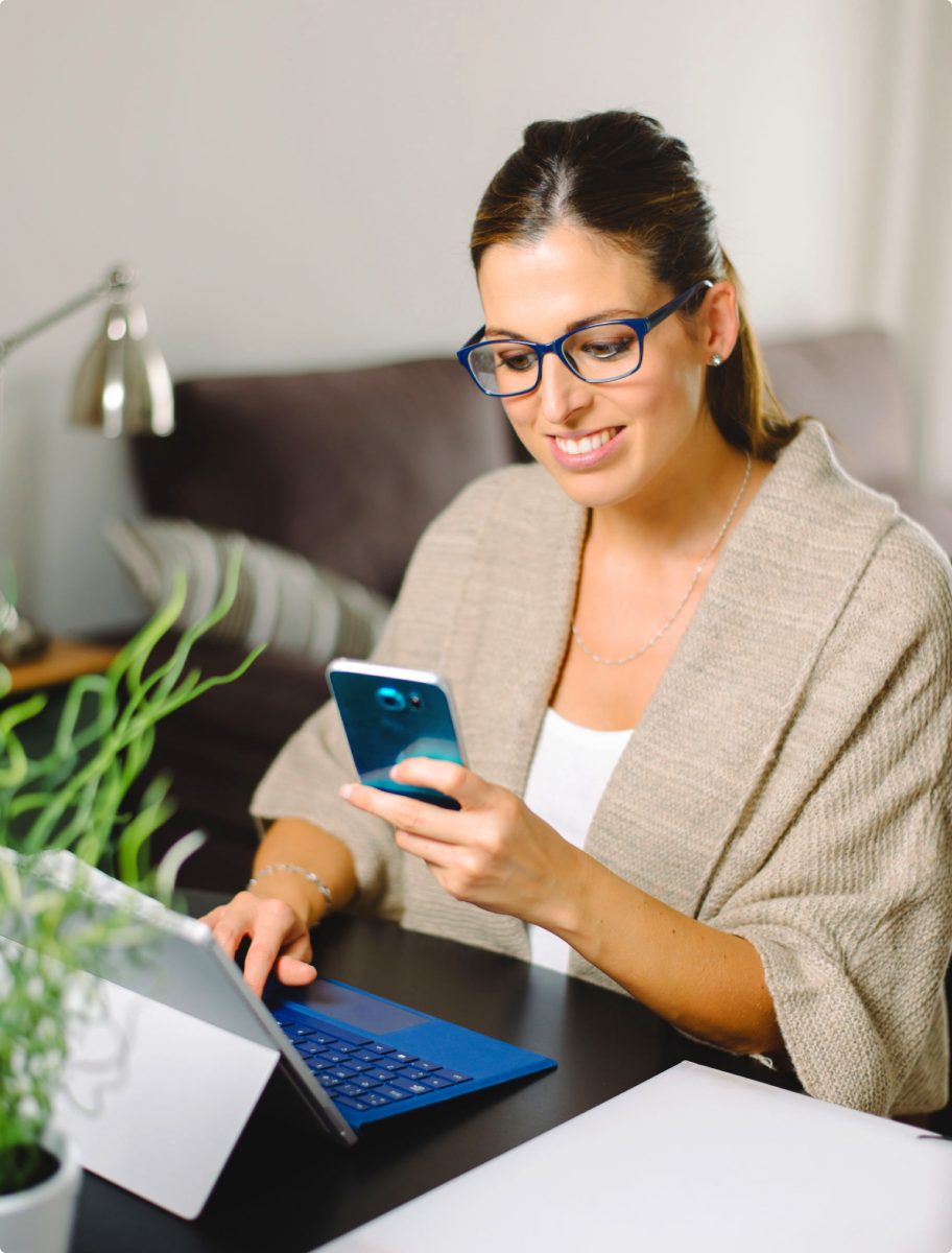 Woman viewing Holistic Billing Services on her mobile device, searching for medical billing services