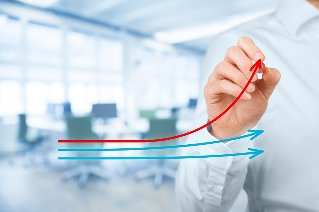 Benchmarking and market leader concept. Manager (businessman, coach, leadership) draw graph with three lines, one of them represent the best company in competition.