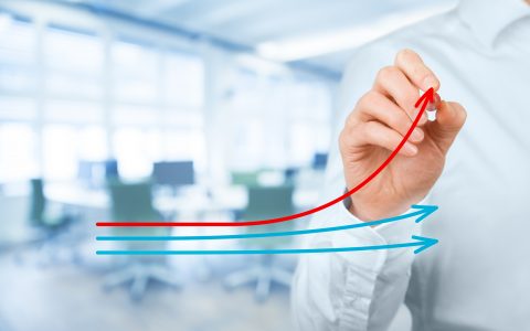 Benchmarking and market leader concept. Manager (businessman, coach, leadership) draw graph with three lines, one of them represent the best company in competition.